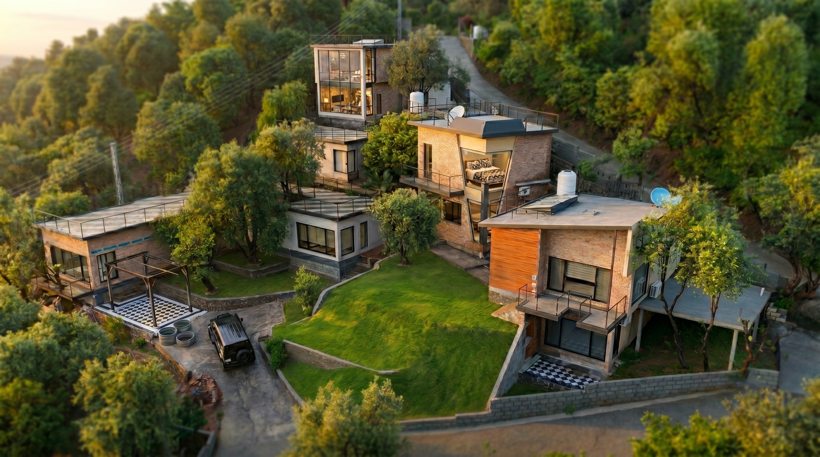 Aerial view of The Olive Hill Cottages across a green hillside