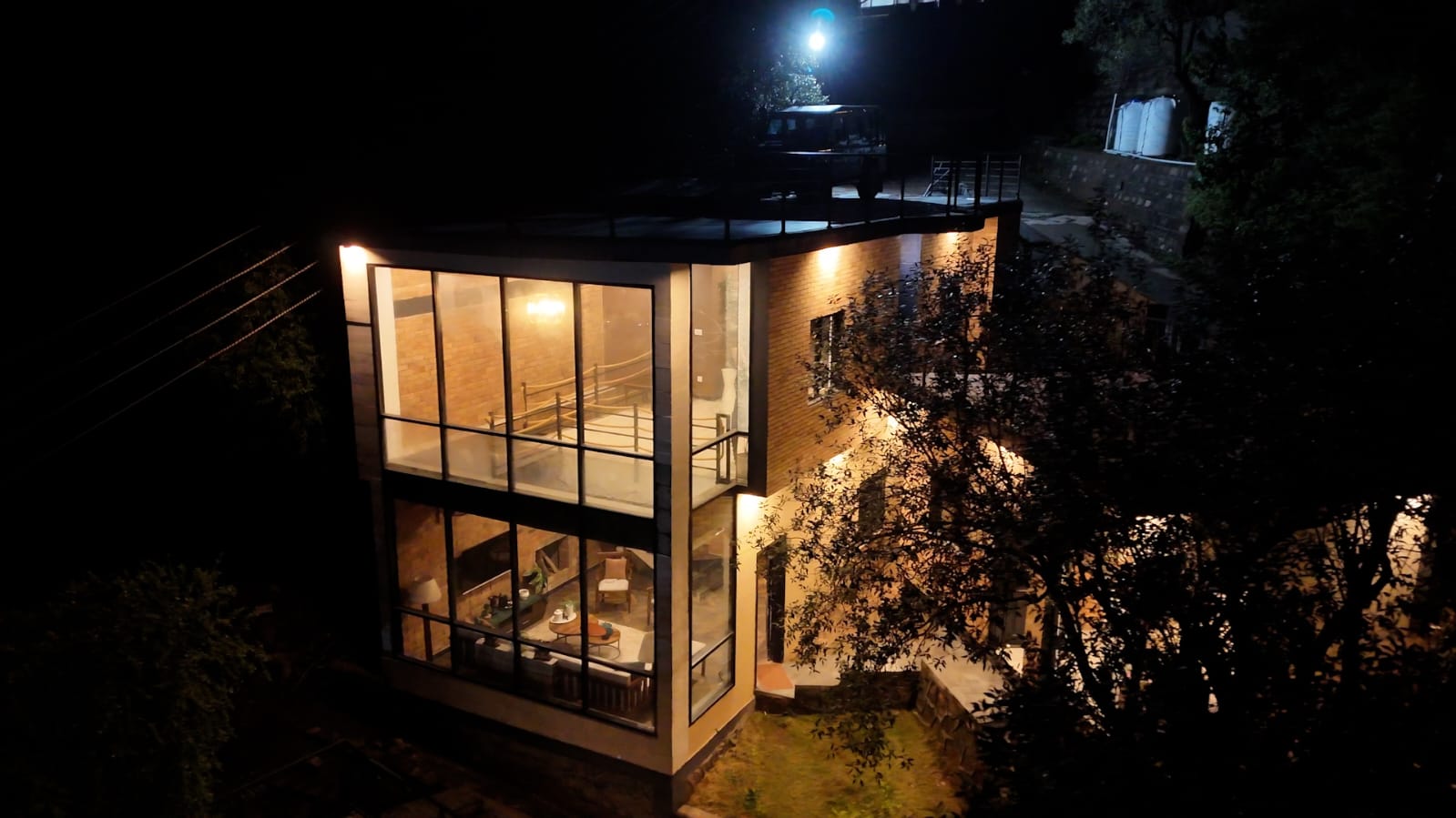 ThaykaydarSaab's Den illuminated against the hillside at night